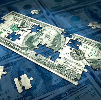 blue background with puzzle pieces depicting a $100 dollar bill